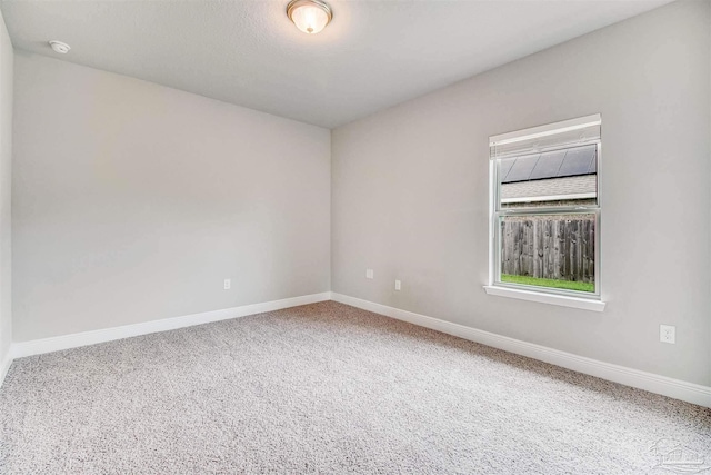 empty room with carpet flooring