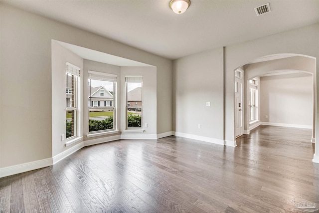 empty room featuring wood-type flooring