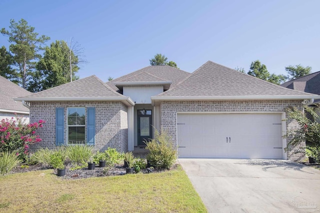 single story home with a garage and a front yard