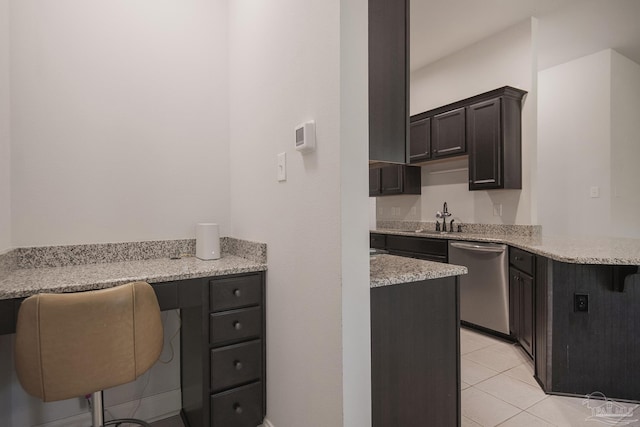 kitchen featuring dishwasher, a kitchen breakfast bar, light tile patterned flooring, light stone counters, and kitchen peninsula