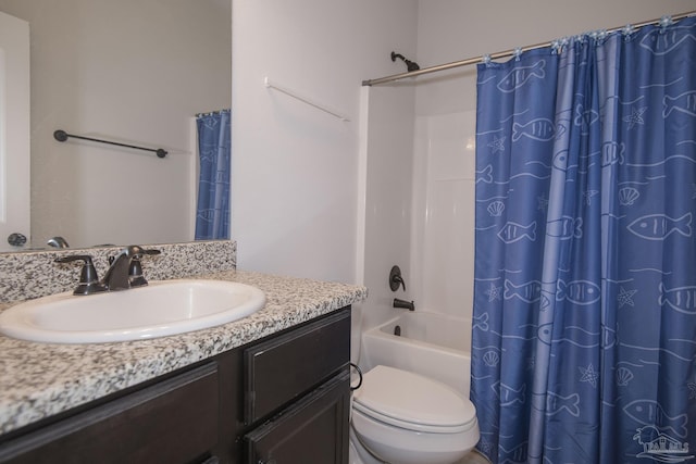 full bathroom with toilet, vanity, and shower / tub combo with curtain