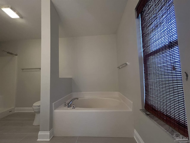 4817 Makenna Cir, Pace, FL 32571 - bathroom featuring toilet, a bath, walk in shower, and tile patterned floors
