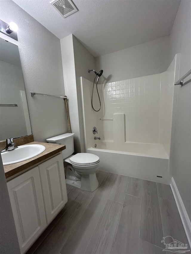 4817 Makenna Cir, Pace, FL 32571 - bathroom featuring toilet, shower / tub combination, vanity, visible vents, and a textured ceiling