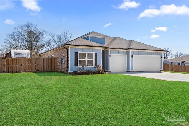 view of front of home with driveway, an attached garage, fence, board and batten siding, and a front yard