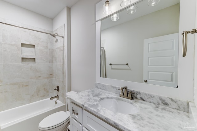 bathroom featuring shower / bath combination, vanity, and toilet