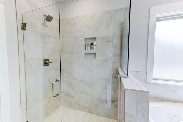 full bath with a garden tub and a shower stall