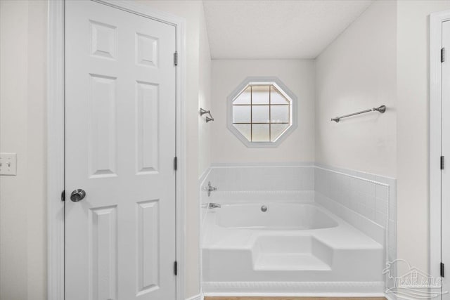 full bathroom featuring a bath