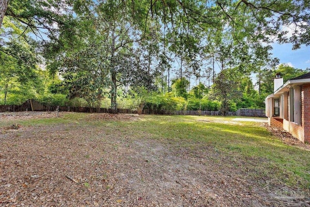 view of yard featuring a fenced backyard