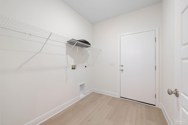 clothes washing area featuring washer hookup, hookup for a gas dryer, light wood-type flooring, and electric dryer hookup