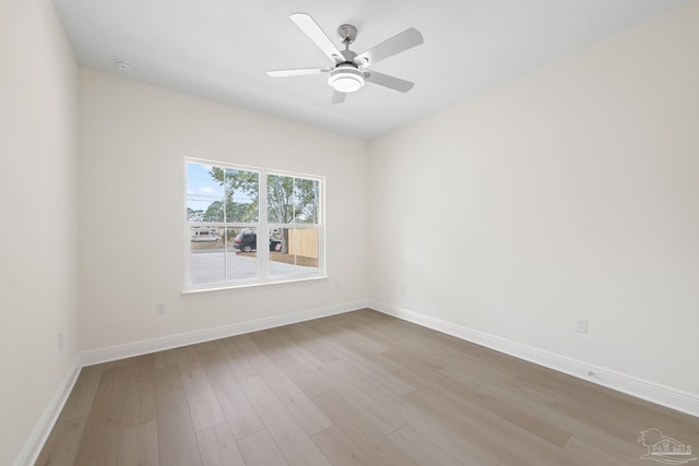 unfurnished room with ceiling fan and light hardwood / wood-style flooring