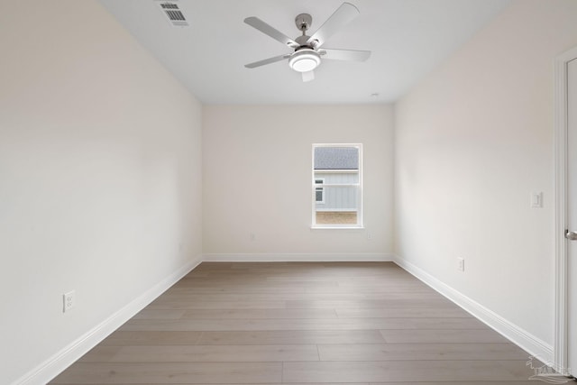 unfurnished room featuring ceiling fan and light hardwood / wood-style flooring