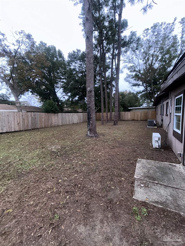 view of yard with central AC unit