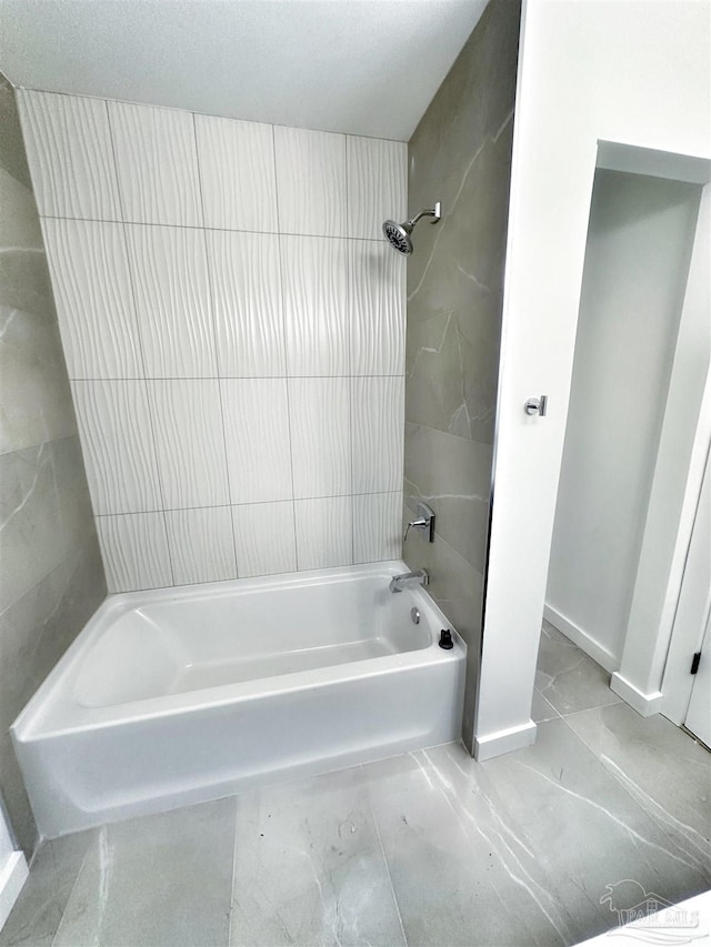 bathroom with  shower combination and baseboards