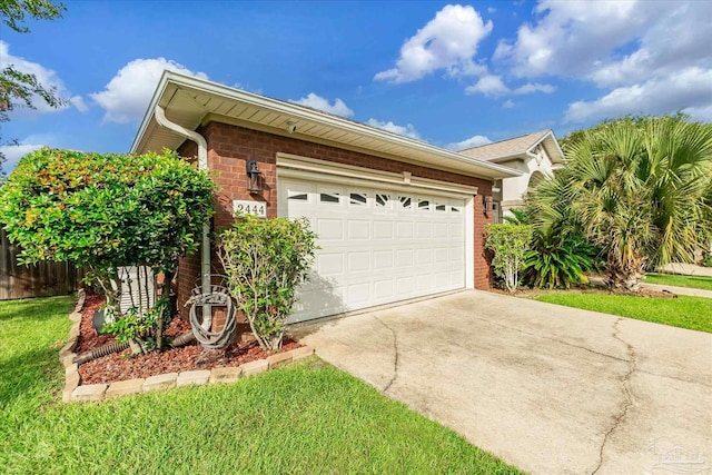 view of side of home with a yard and a garage