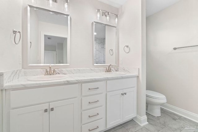 3721 Martin St, Pace, FL 32571 - bathroom featuring double vanity, marble finish flooring, toilet, and baseboards