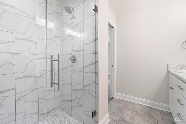 3721 Martin St, Pace, FL 32571 - bathroom with vanity, a marble finish shower, baseboards, and marble look tile flooring