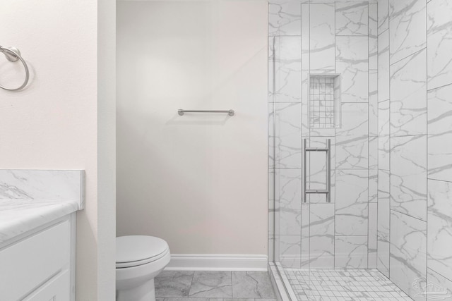 3721 Martin St, Pace, FL 32571 - bathroom with marble finish floors, a stall shower, toilet, vanity, and baseboards