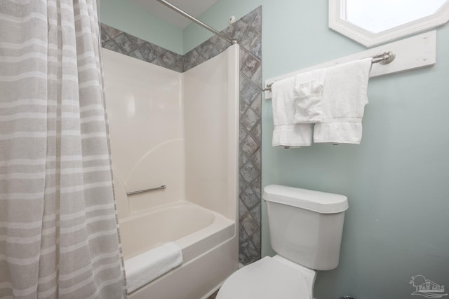 full bathroom with toilet and shower / bath combo with shower curtain