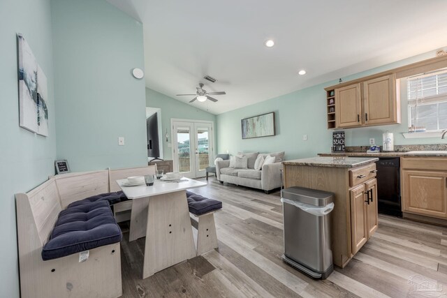 kitchen with french doors, dishwasher, open floor plan, and light brown cabinetry