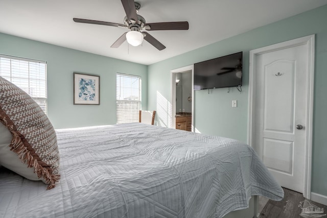 bedroom featuring ceiling fan and ensuite bath