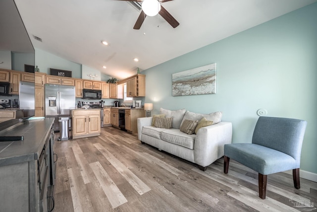 living area with light wood finished floors, visible vents, lofted ceiling, ceiling fan, and recessed lighting