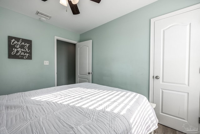 bedroom featuring ceiling fan and visible vents