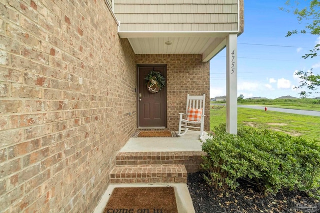 property entrance with brick siding