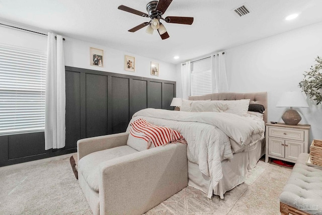 bedroom with a ceiling fan, recessed lighting, visible vents, and light colored carpet