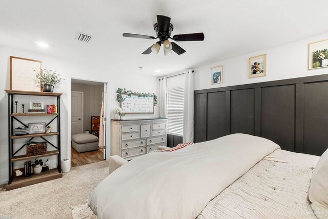 carpeted bedroom with ceiling fan