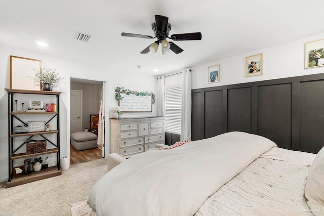 bedroom with visible vents, wainscoting, ceiling fan, carpet floors, and recessed lighting