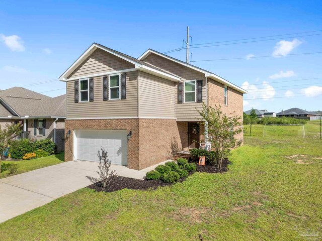 view of front of property featuring a garage and a front lawn