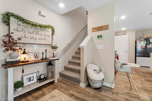 staircase featuring hardwood / wood-style floors