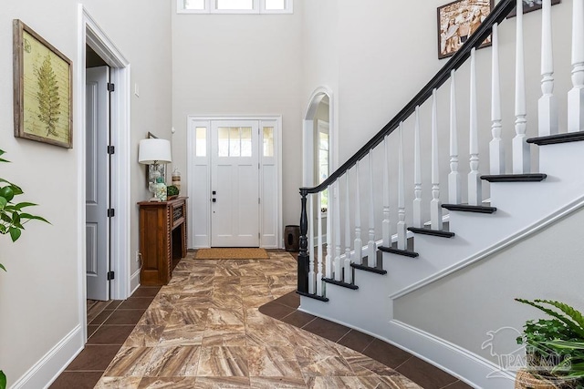 2 Bayou Blvd, Pensacola, FL 32503 - foyer featuring stairs, baseboards, and a towering ceiling