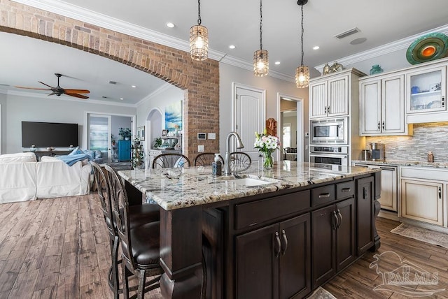 2 Bayou Blvd, Pensacola, FL 32503 - kitchen featuring a ceiling fan, a kitchen bar, visible vents, appliances with stainless steel finishes, and a sink