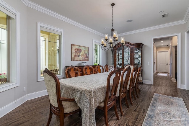 2 Bayou Blvd, Pensacola, FL 32503 - dining space with crown molding, baseboards, an inviting chandelier, and visible vents