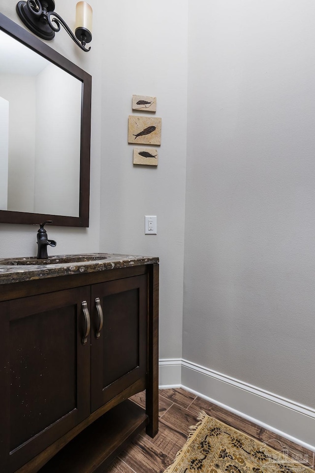 2 Bayou Blvd, Pensacola, FL 32503 - bathroom featuring baseboards, wood finished floors, and vanity