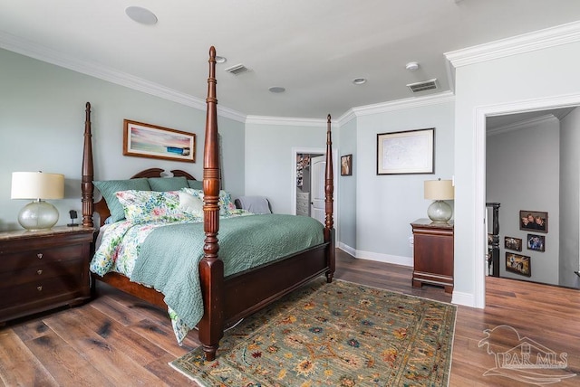 2 Bayou Blvd, Pensacola, FL 32503 - bedroom with visible vents, baseboards, crown molding, and wood finished floors