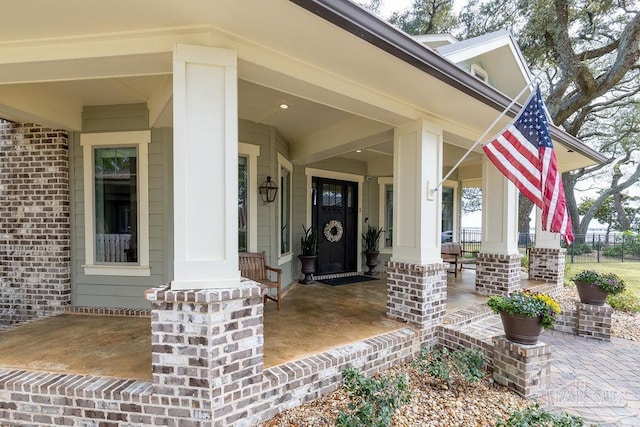 2 Bayou Blvd, Pensacola, FL 32503 - view of exterior entry featuring a porch and brick siding