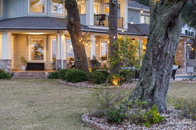 2 Bayou Blvd, Pensacola, FL 32503 - entrance to property featuring a lawn, board and batten siding, and roof with shingles
