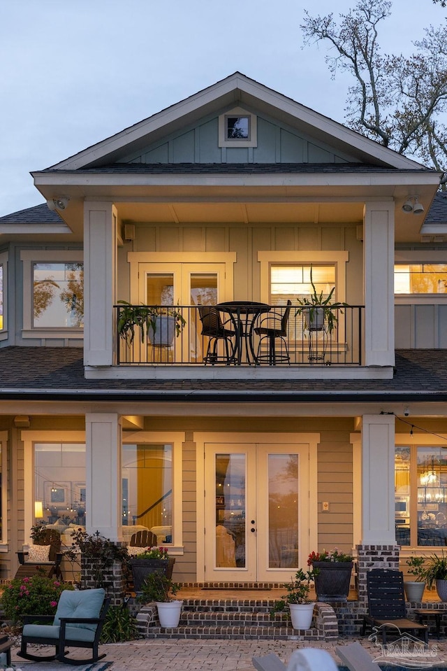 2 Bayou Blvd, Pensacola, FL 32503 - back of property with board and batten siding, french doors, and a balcony