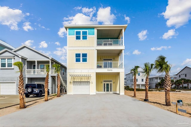 raised beach house with a balcony and a garage