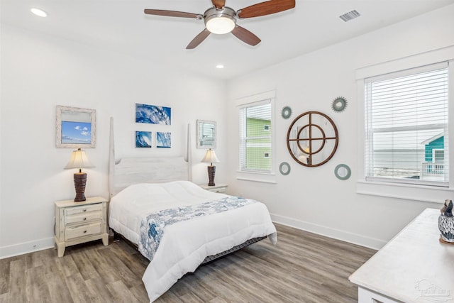 bedroom featuring ceiling fan and wood-type flooring