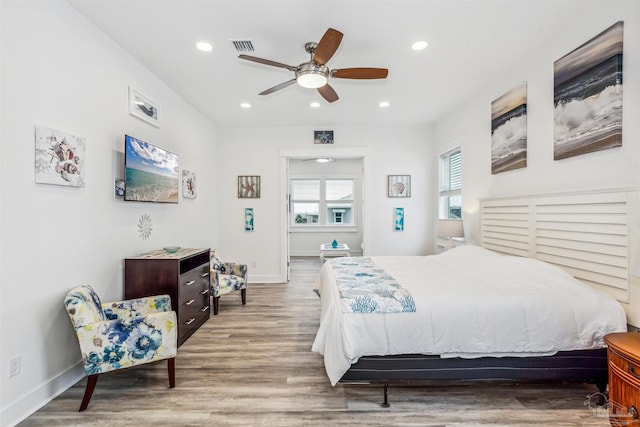 bedroom featuring hardwood / wood-style flooring and ceiling fan