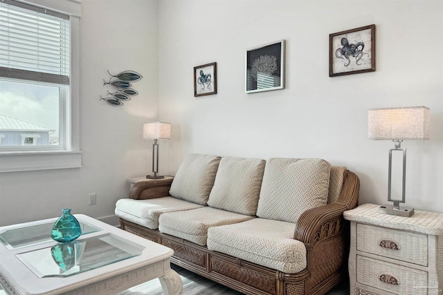 7395 Grand Navarre Blvd, Navarre Beach, FL 32566 - living area featuring healthy amount of natural light and wood finished floors