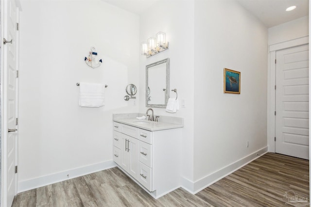 bathroom featuring vanity and wood-type flooring