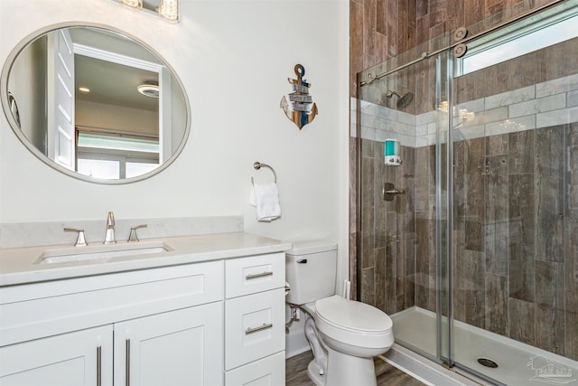 7395 Grand Navarre Blvd, Navarre Beach, FL 32566 - full bathroom with a stall shower, toilet, and vanity