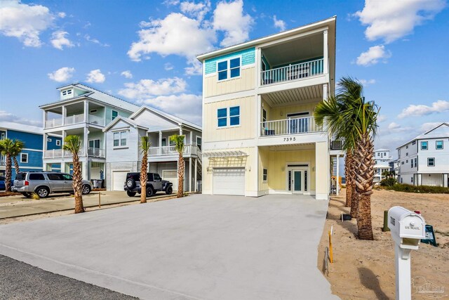 view of front facade featuring a balcony and a garage