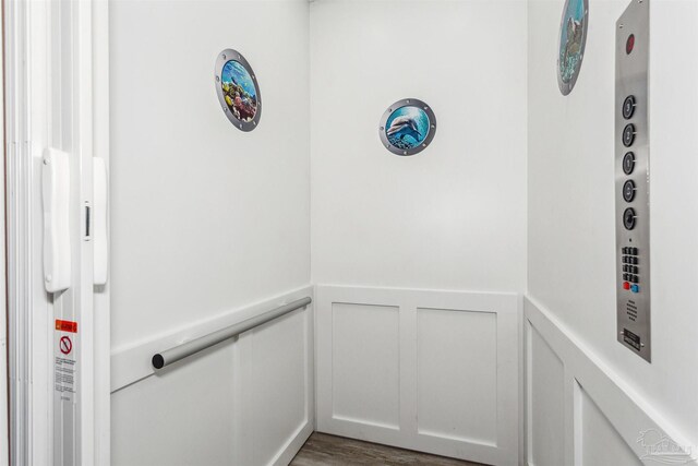 7395 Grand Navarre Blvd, Navarre Beach, FL 32566 - elevator featuring wainscoting and a decorative wall