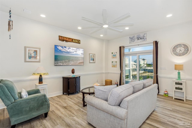 7395 Grand Navarre Blvd, Navarre Beach, FL 32566 - living room featuring ceiling fan, light wood-style flooring, recessed lighting, and baseboards