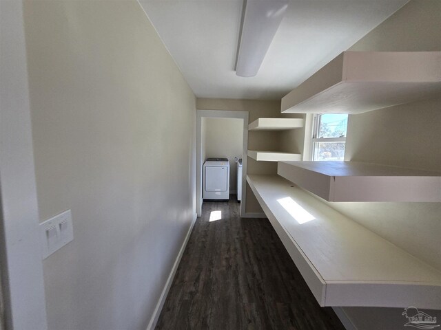 hallway featuring dark hardwood / wood-style flooring and washer / dryer